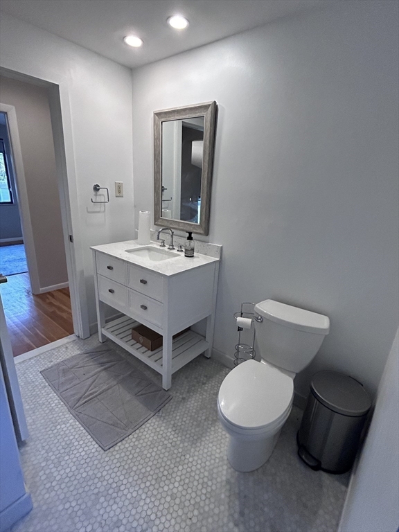 44 Marla Circle Newton, MA 02459 - Photo 15 of 23 a bathroom with a toilet a sink and mirror
