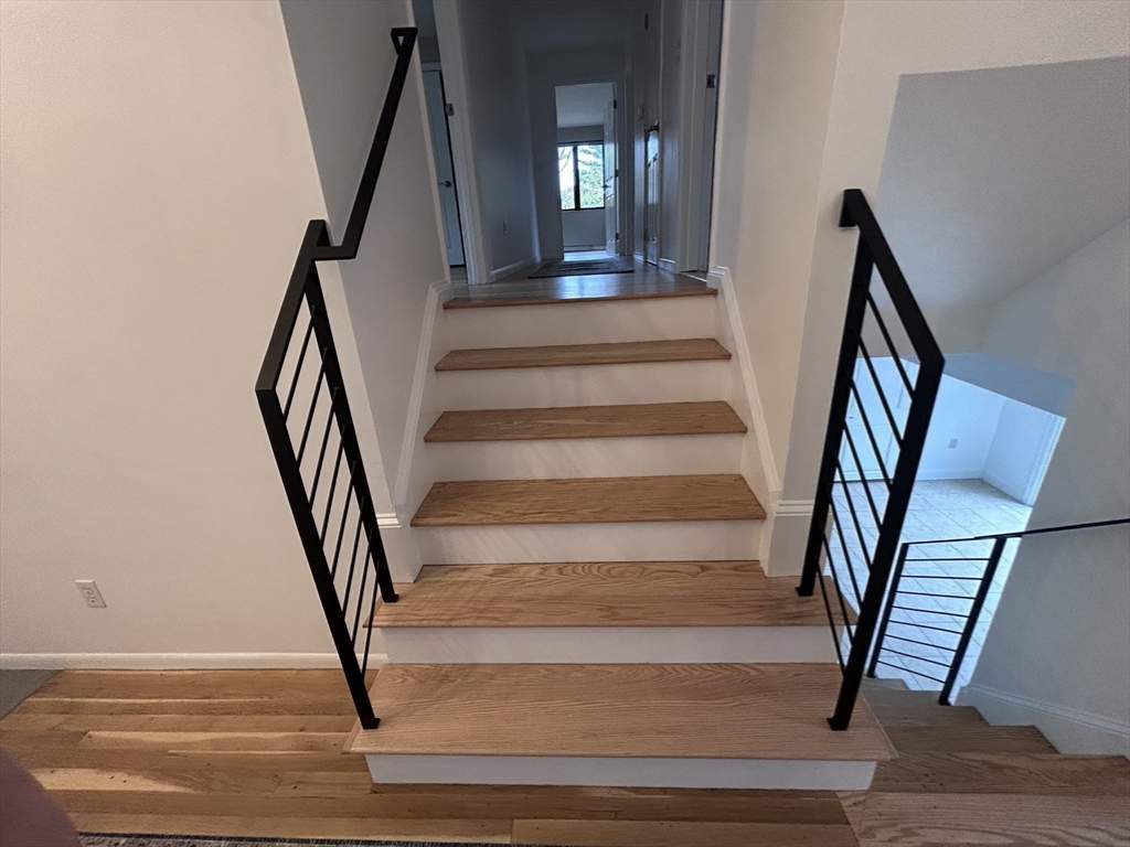 44 Marla Circle Newton, MA 02459 - Photo 17 of 23 a view of staircase with wooden floor and a chandelier