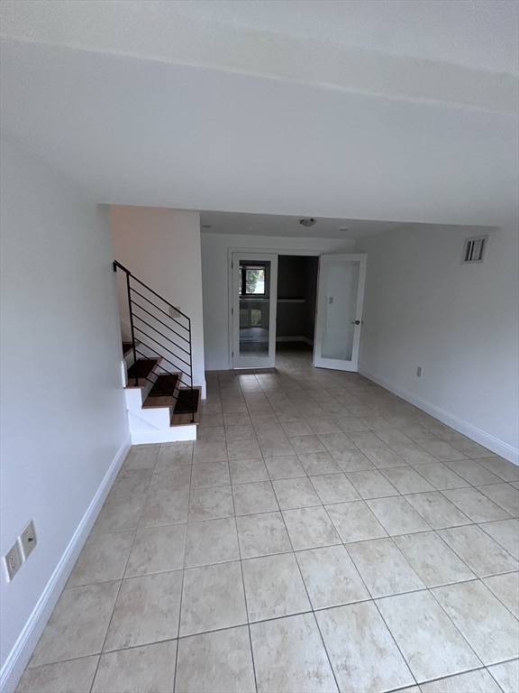 44 Marla Circle Newton, MA 02459 - Photo 21 of 23 a view of an empty room with a window