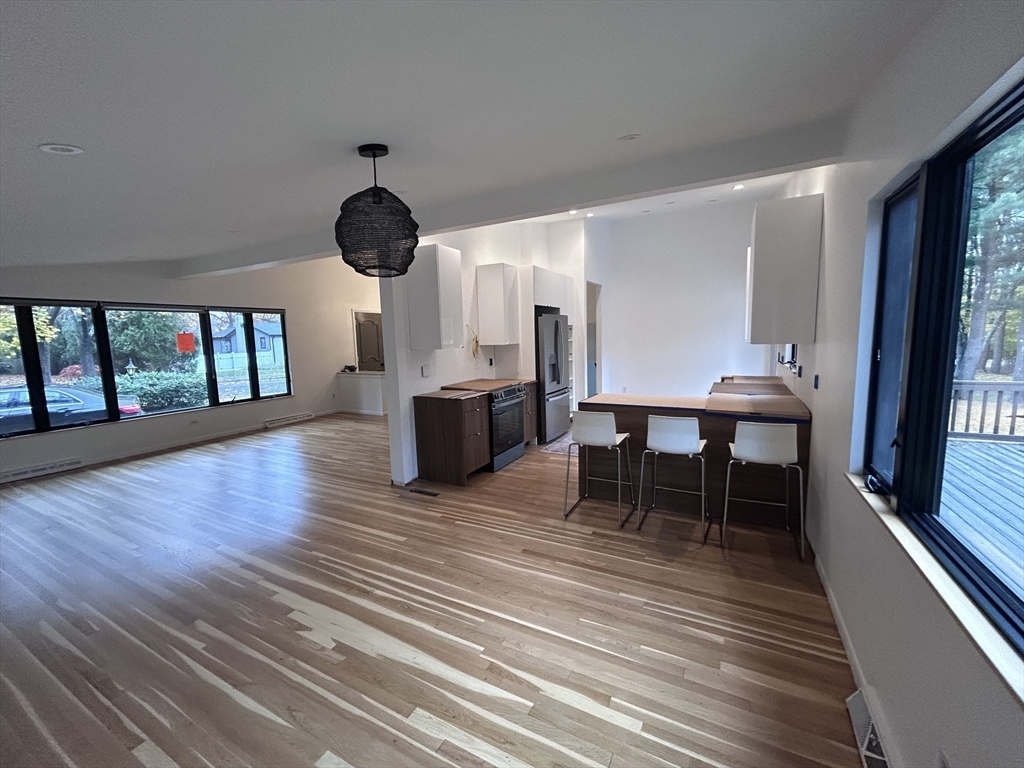 44 Marla Circle Newton, MA 02459 - Photo 3 of 23 a dining room with furniture and wooden floor
