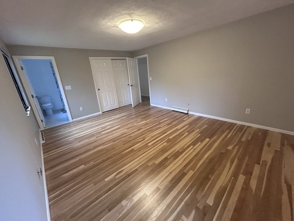 44 Marla Circle Newton, MA 02459 - Photo 9 of 23 a view of empty room with wooden floor