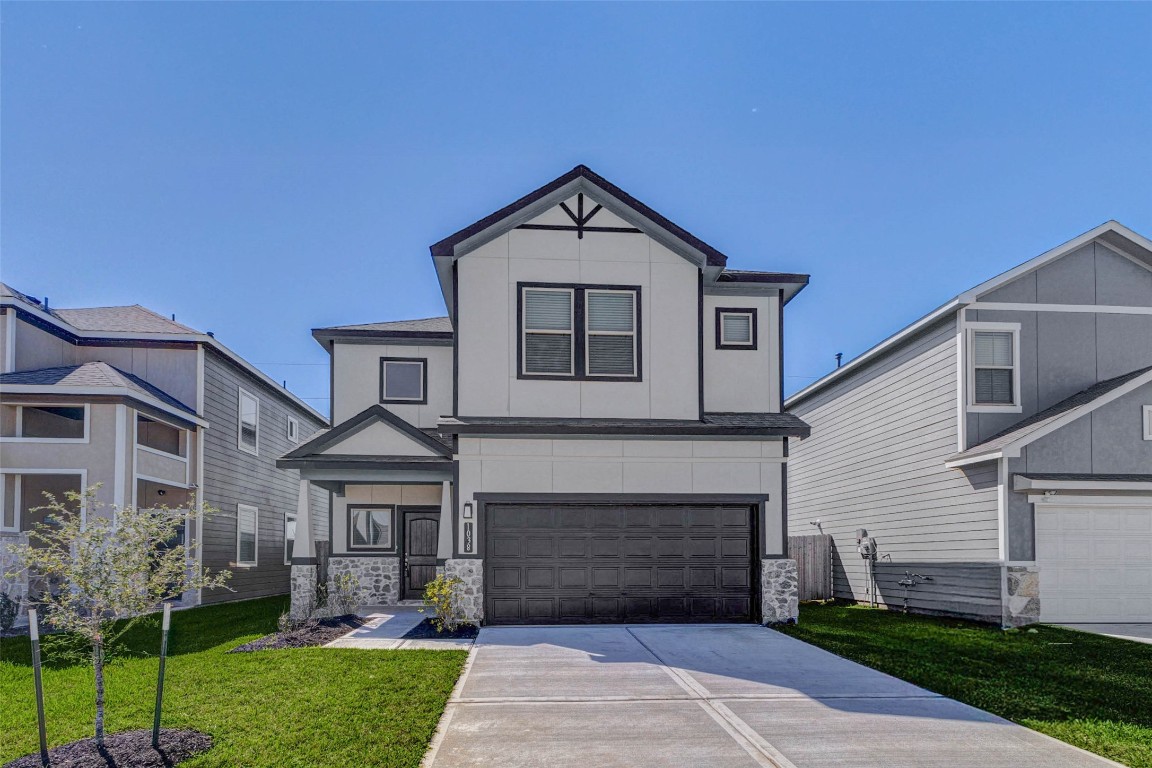 1038 Elsinore Drive Rosharon, TX 77583 - Photo 1 of 27 This centered front view highlights the home's symmetrical design and contemporary architectural details. Crisp white siding accented by dark trim creates a bold contrast, while the covered front entry adds character and protection from the elements. The wide driveway and attached garage offer everyday convenience, and the neatly maintained lawn enhances the home's welcoming presence within this attractive and well-planned community.