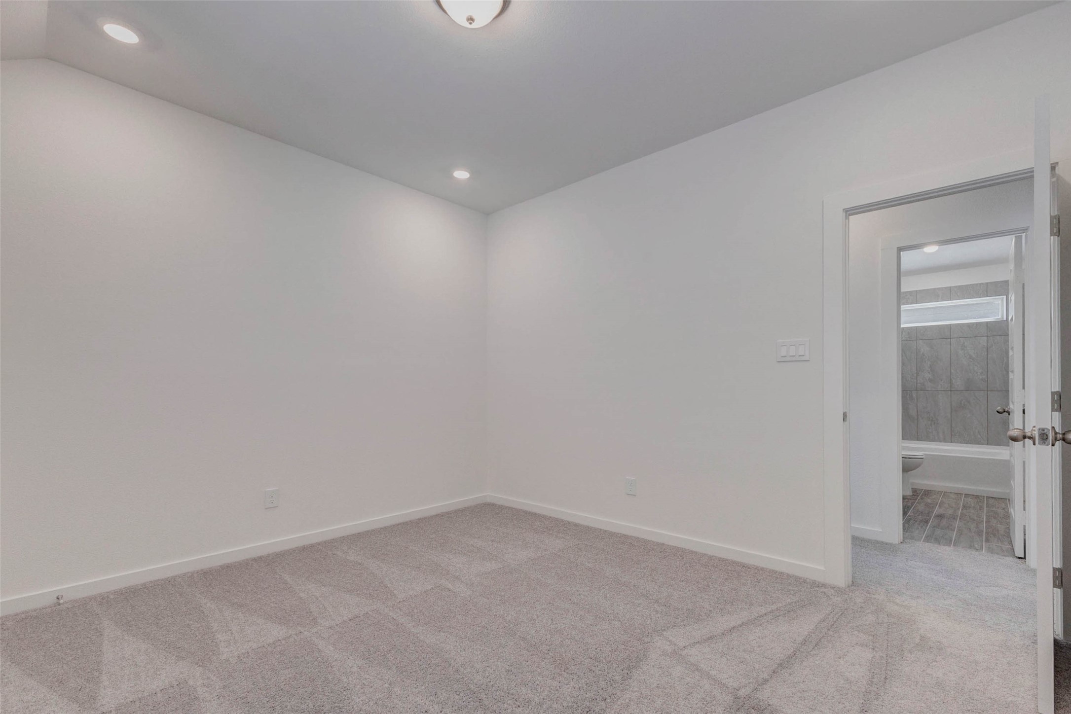 1038 Elsinore Drive Rosharon, TX 77583 - Photo 16 of 27 Another spacious bedroom features fresh carpeting, clean lines, and a bright window that allows natural light to fill the room. The neutral color palette makes it easy to personalize with your own décor, while the layout offers plenty of room for a bed, desk, or additional storage furniture. This flexible space works perfectly as a bedroom, guest room, or private workspace.
