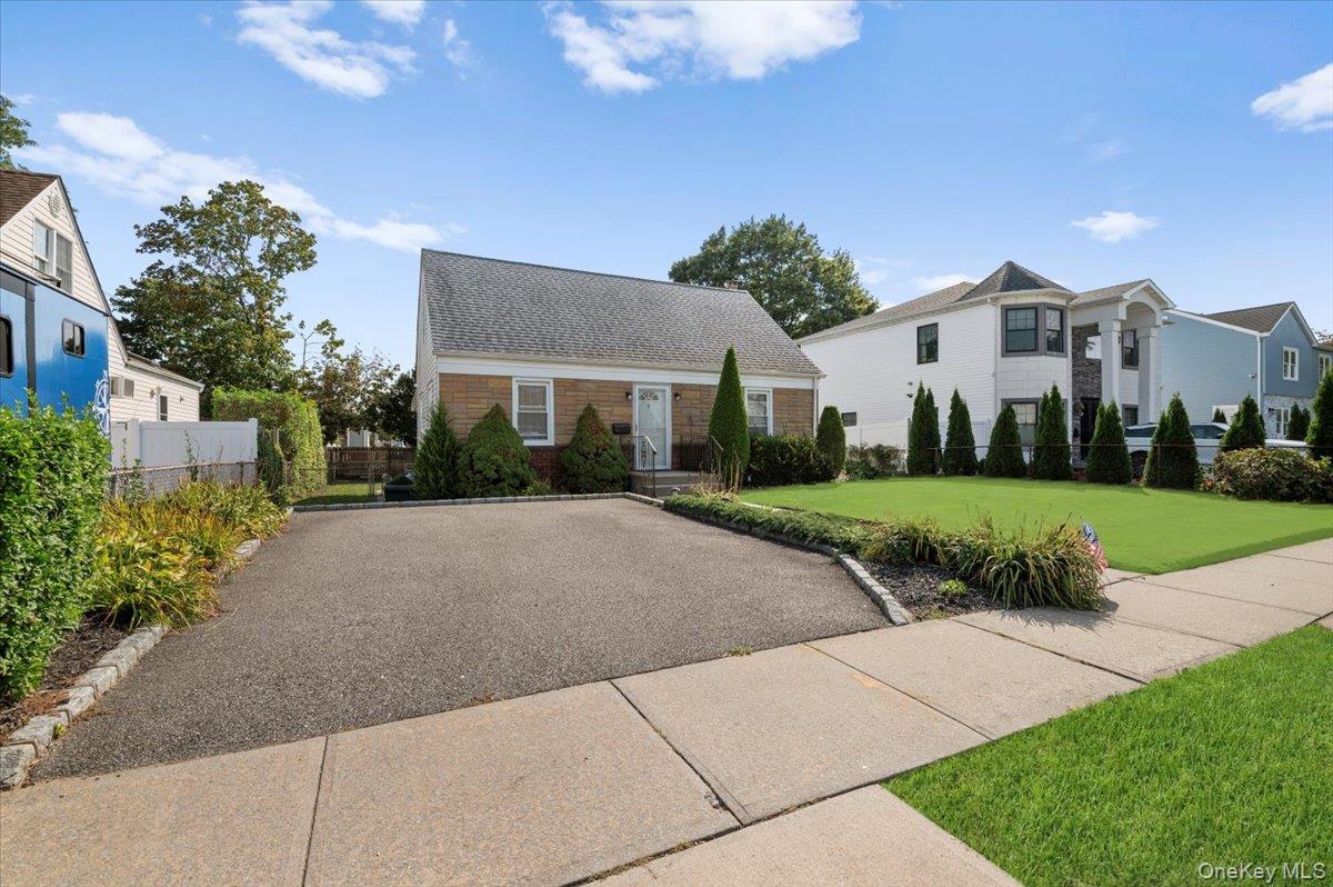 5 Totten Street Bethpage, NY 11714 - Photo 1 of 1 a view of a white house with a yard