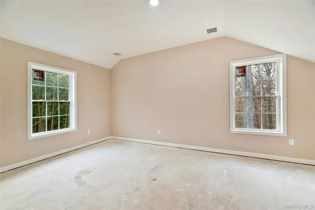 a bathroom with a bathtub shower sink vanity and toilet