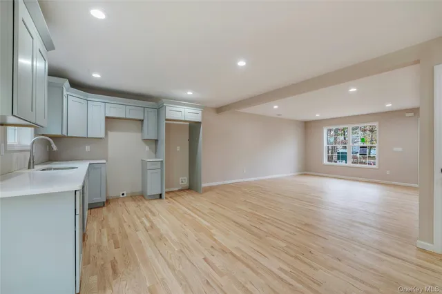 a picture of a bench in a white wall