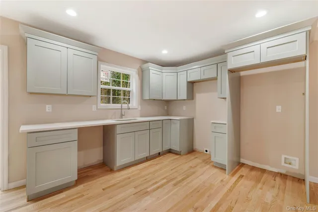 a kitchen with a refrigerator and window