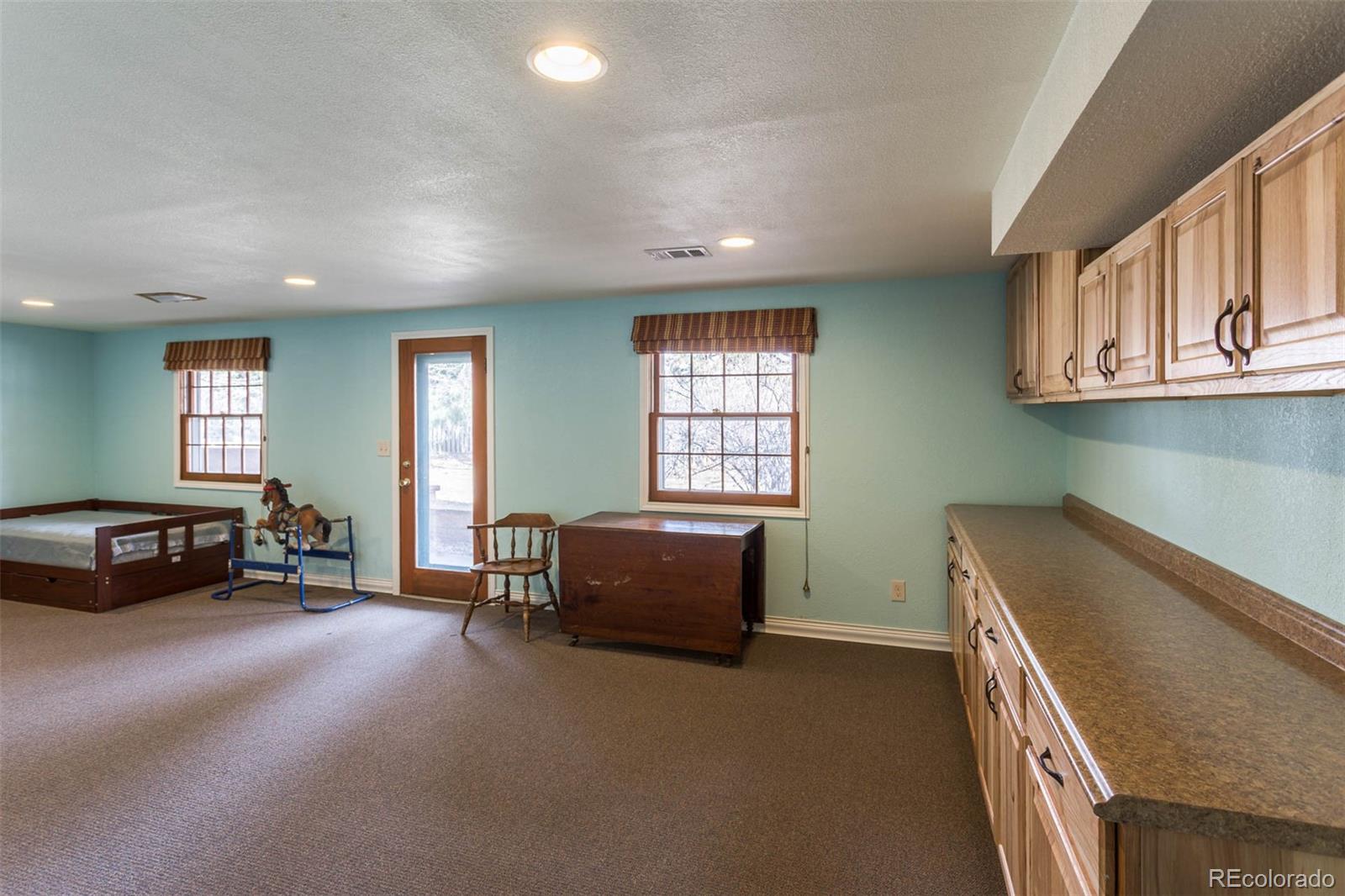 870 Willowbrook Road Boulder, CO 80302 - Photo 19 of 30 a living room with furniture and a window