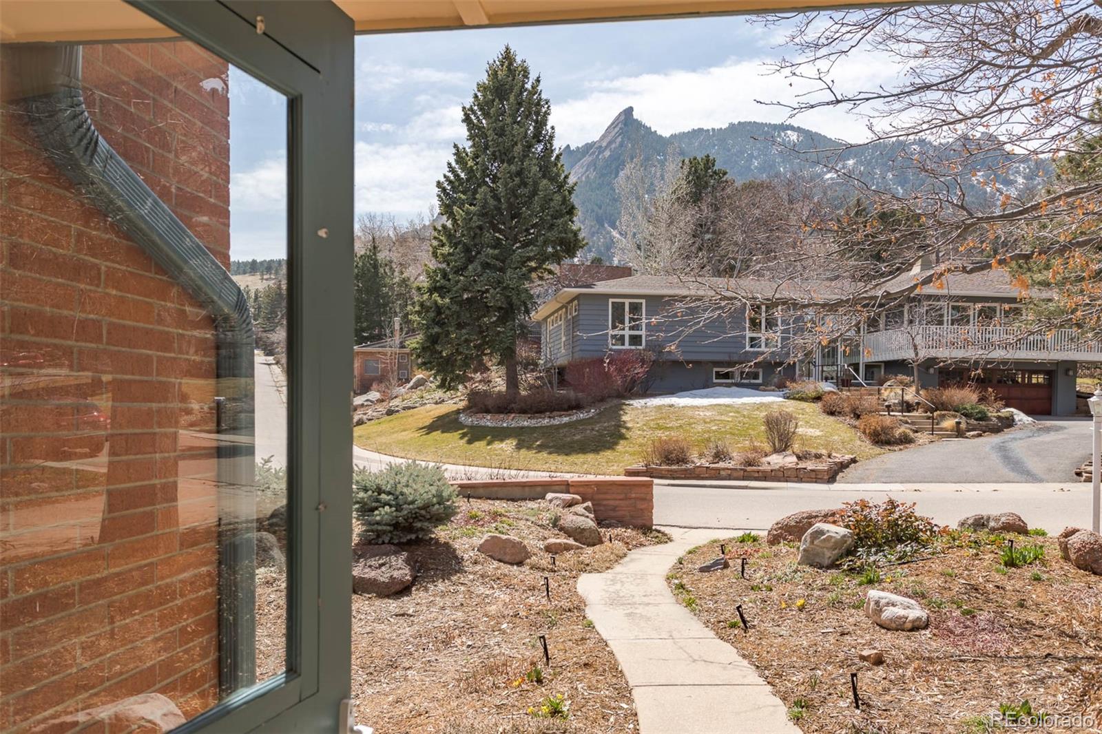 870 Willowbrook Road Boulder, CO 80302 - Photo 2 of 30 a view of a swimming pool with an outdoor seating
