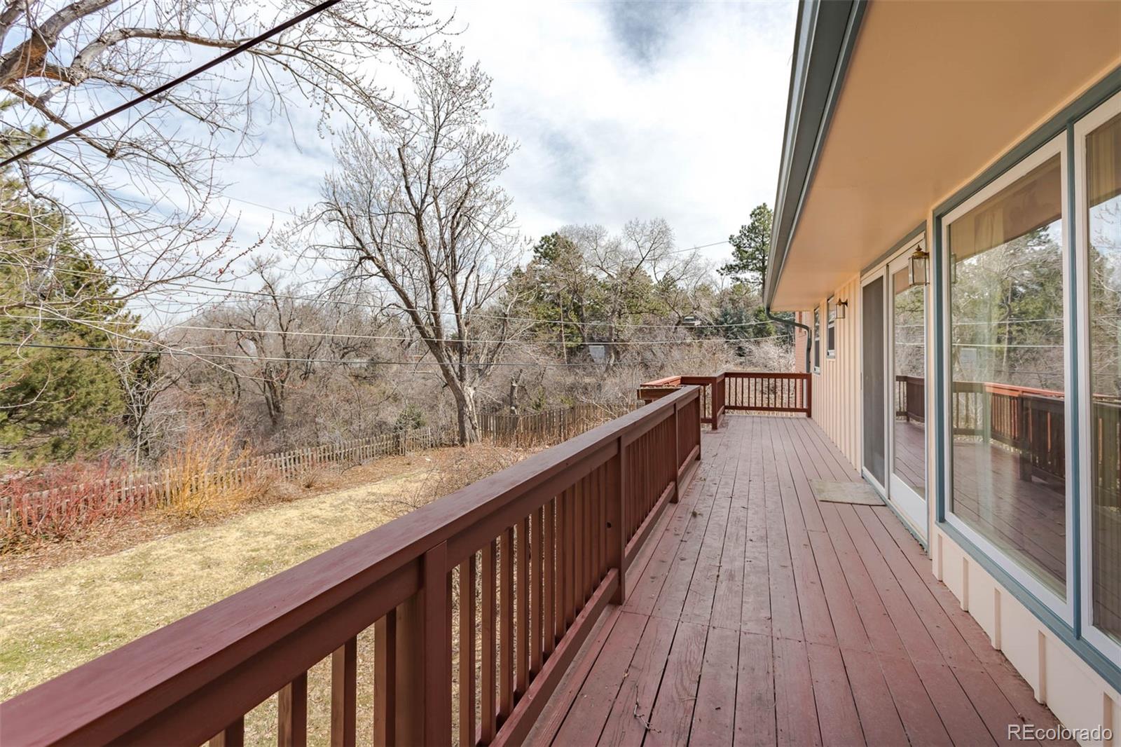 870 Willowbrook Road Boulder, CO 80302 - Photo 23 of 30 a view of balcony with wooden floor and fence
