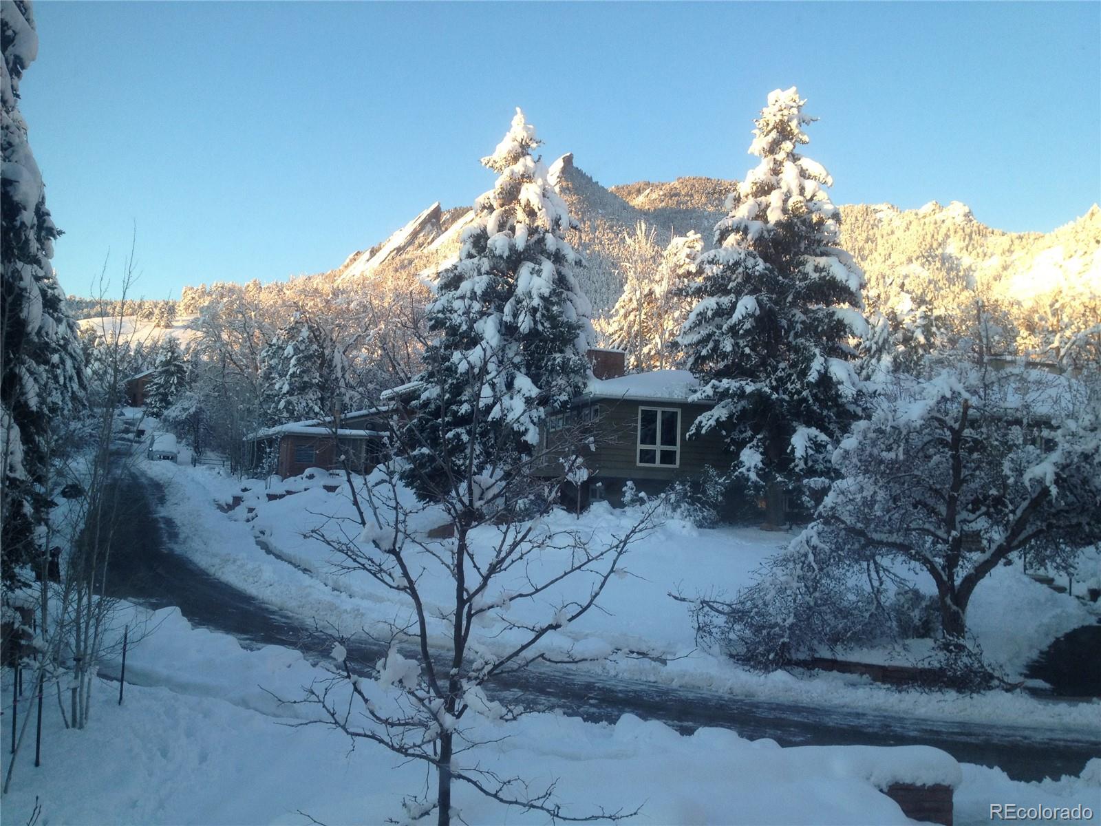 870 Willowbrook Road Boulder, CO 80302 - Photo 27 of 30 a view of a house with a snow in the background