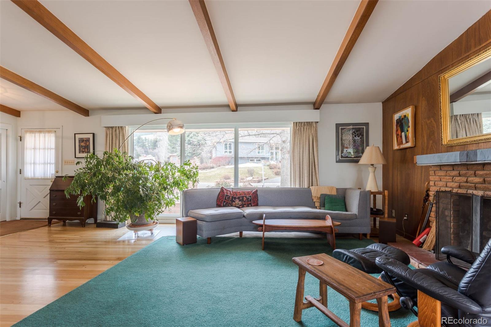 870 Willowbrook Road Boulder, CO 80302 - Photo 3 of 30 a living room with furniture and a fireplace