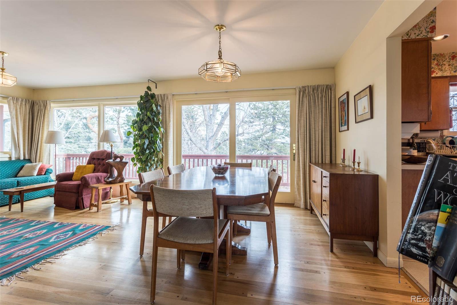 870 Willowbrook Road Boulder, CO 80302 - Photo 6 of 30 a view of a dining room with furniture window and wooden floor