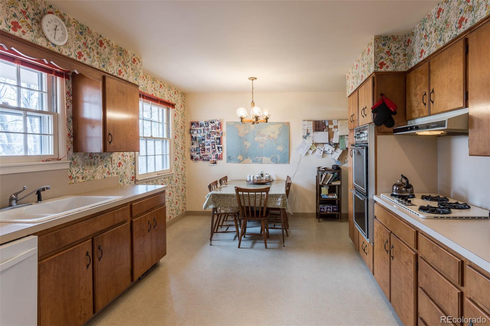 870 Willowbrook Road Boulder, CO 80302 - Photo 10 of 30 a kitchen with refrigerator a stove a sink and chairs