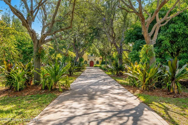 a living room with furniture a fireplace and a large window