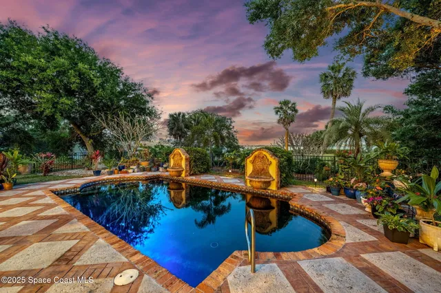 a view of a swimming pool with a patio