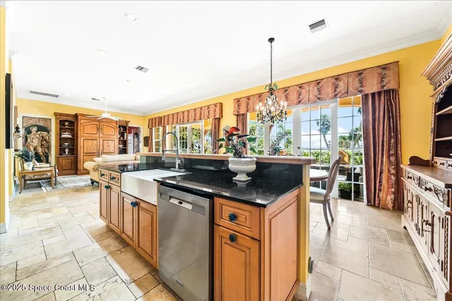 a spacious bathroom with a granite countertop double vanity and a mirror