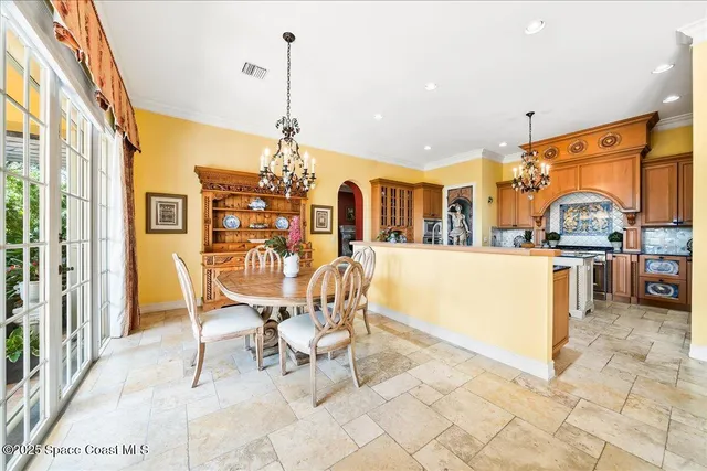 a view of a swimming pool with a patio and a yard