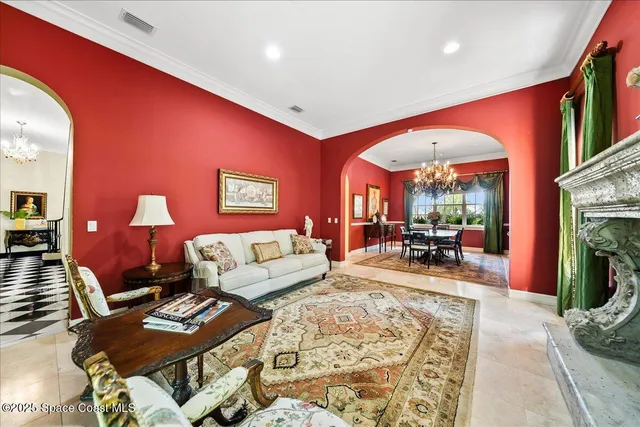 a view of a house with swimming pool and sitting area