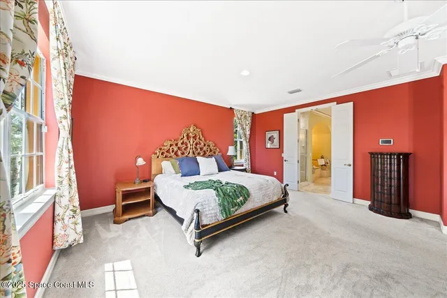 an aerial view of a house with swimming pool and garden space