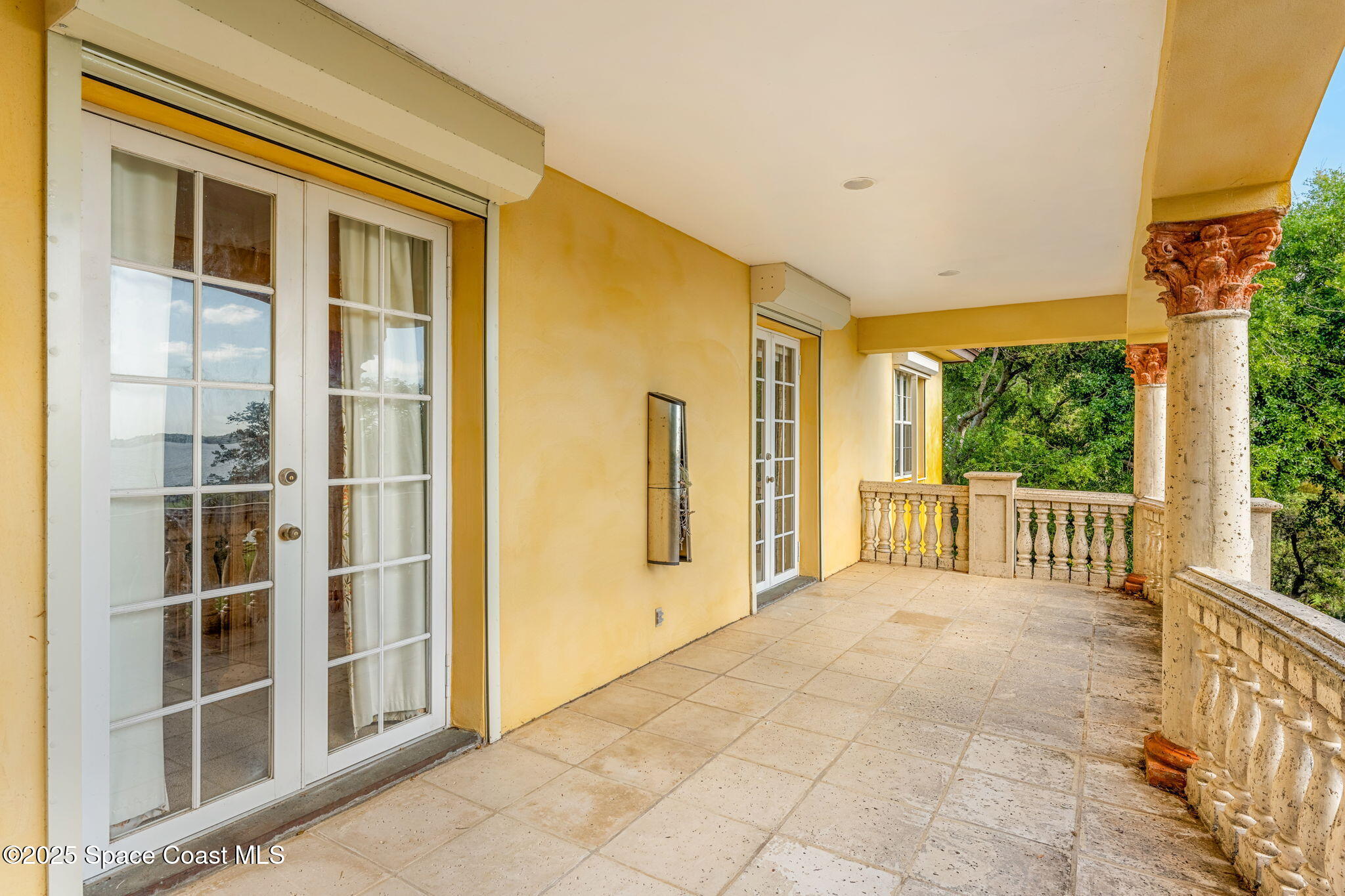 9340 South Tropical Trail Merritt Island, FL 32952 - Photo 47 of 100 a view of a balcony with wooden floor and fence