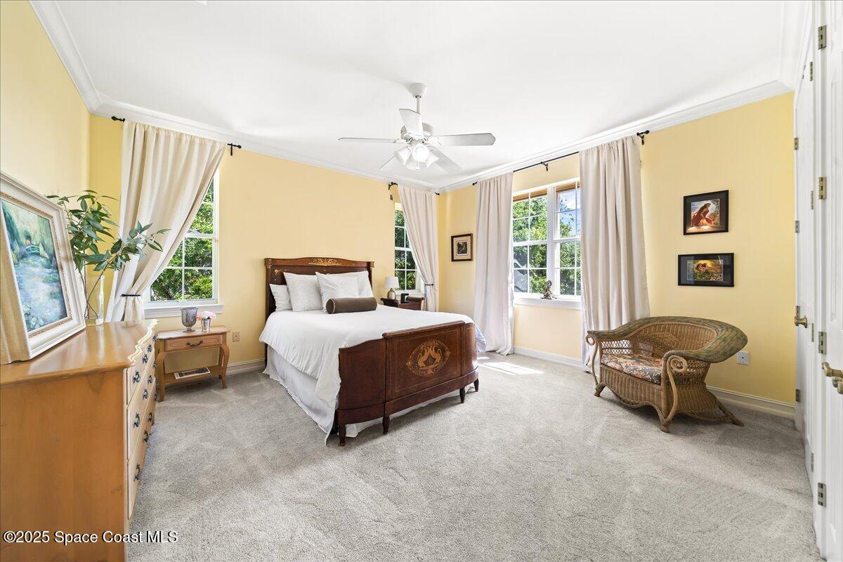 9340 South Tropical Trail Merritt Island, FL 32952 - Photo 52 of 100 a bedroom with a bed and a window
