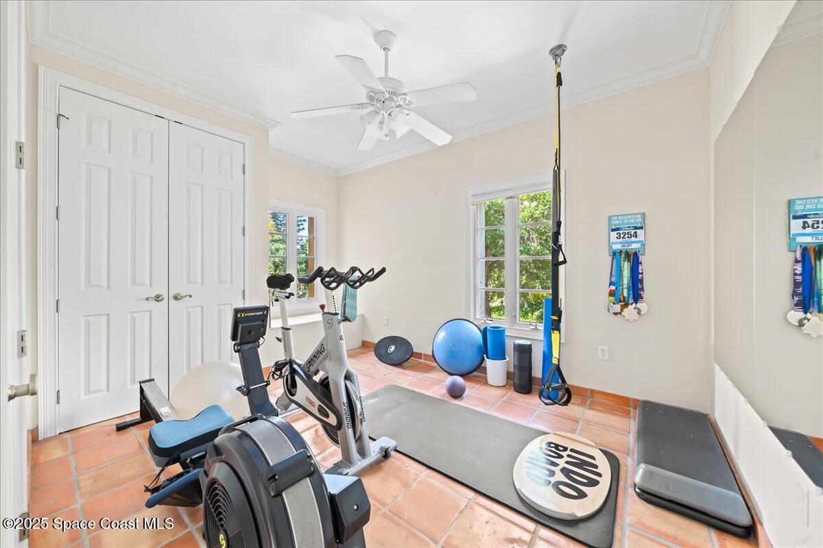9340 South Tropical Trail Merritt Island, FL 32952 - Photo 54 of 100 a view of a workspace with furniture and a window