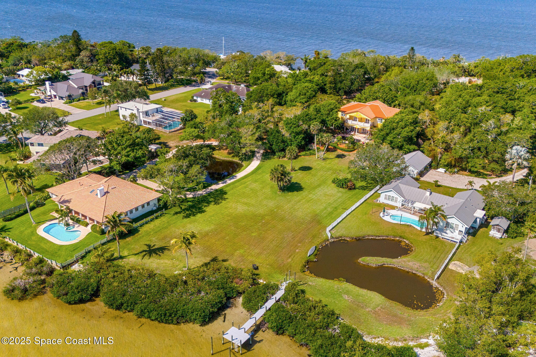 9340 South Tropical Trail Merritt Island, FL 32952 - Photo 90 of 100 55-web-or-mls-DJI_20250407110618_0037_D