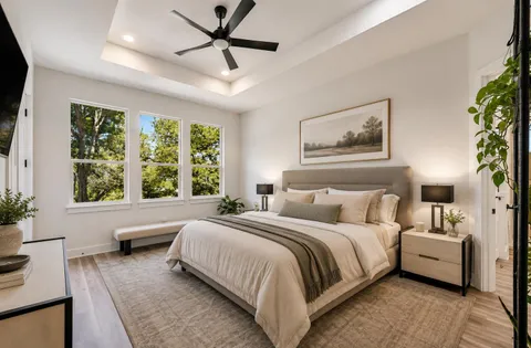 a bedroom with a large bed and a window