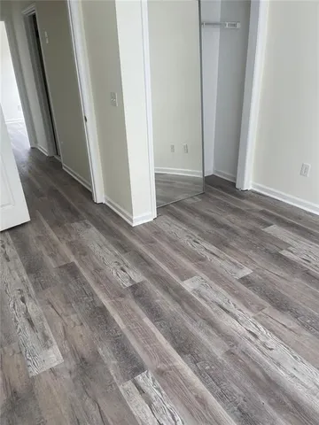 a kitchen with stainless steel appliances granite countertop a refrigerator sink stove microwave and cabinets