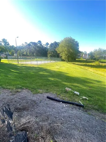 a view of a lake with houses in the back