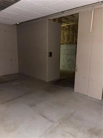 a view of room with window and wooden floor