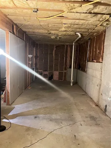 a view of a room with equipment and a chandelier