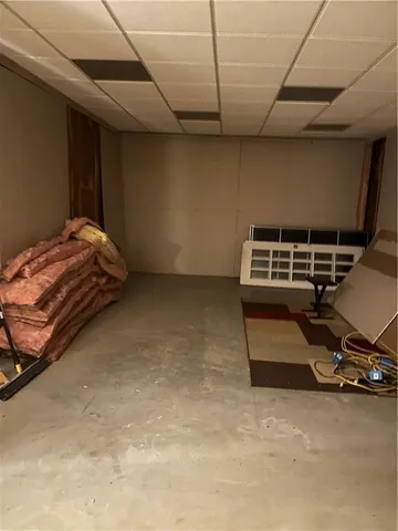 a view of a room with wooden floor windows and a sink