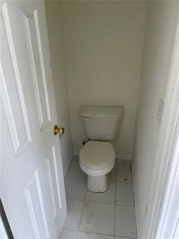 a view of balcony with wooden floor and fence