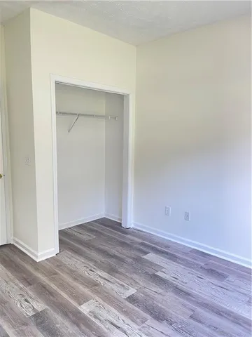 a bathroom with a granite countertop bathtub next to a window