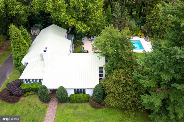 a aerial view of a house with a yard and garage