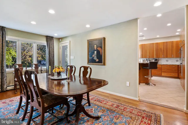 a kitchen with kitchen island granite countertop a sink stainless steel appliances and cabinets
