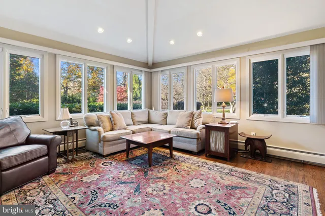 a view of hallway with paintings on the wall