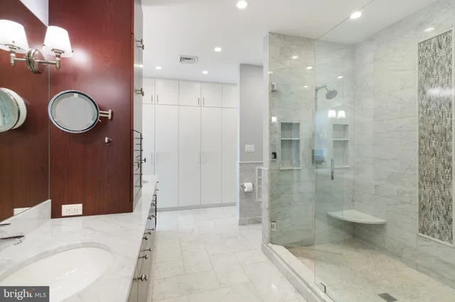 a bathroom with a bathtub and a shower