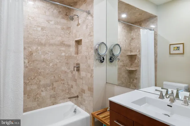 a bedroom with a bed and a dresser