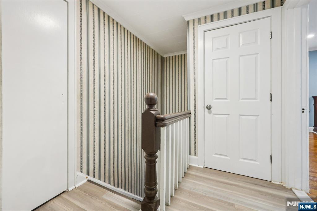 320 Orient Way, Unit 2 Rutherford, NJ 07070 - Photo 17 of 40 a view of a hallway with wooden floor and entryway