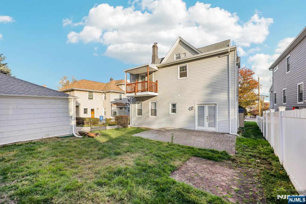 320 Orient Way, Unit 2 Rutherford, NJ 07070 - Photo 29 of 40 a front view of a house with garden