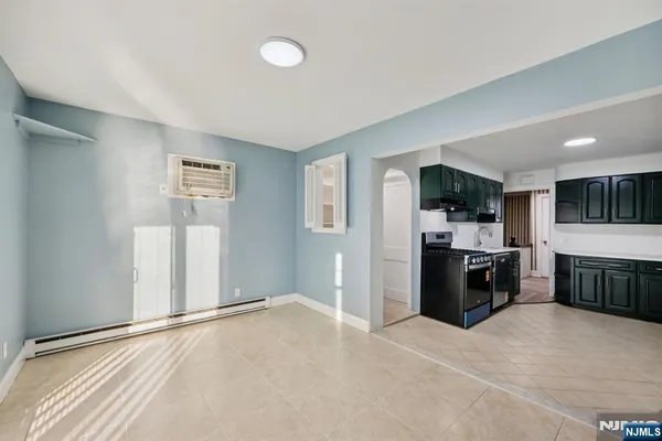 a view of a kitchen with a sink and cabinets