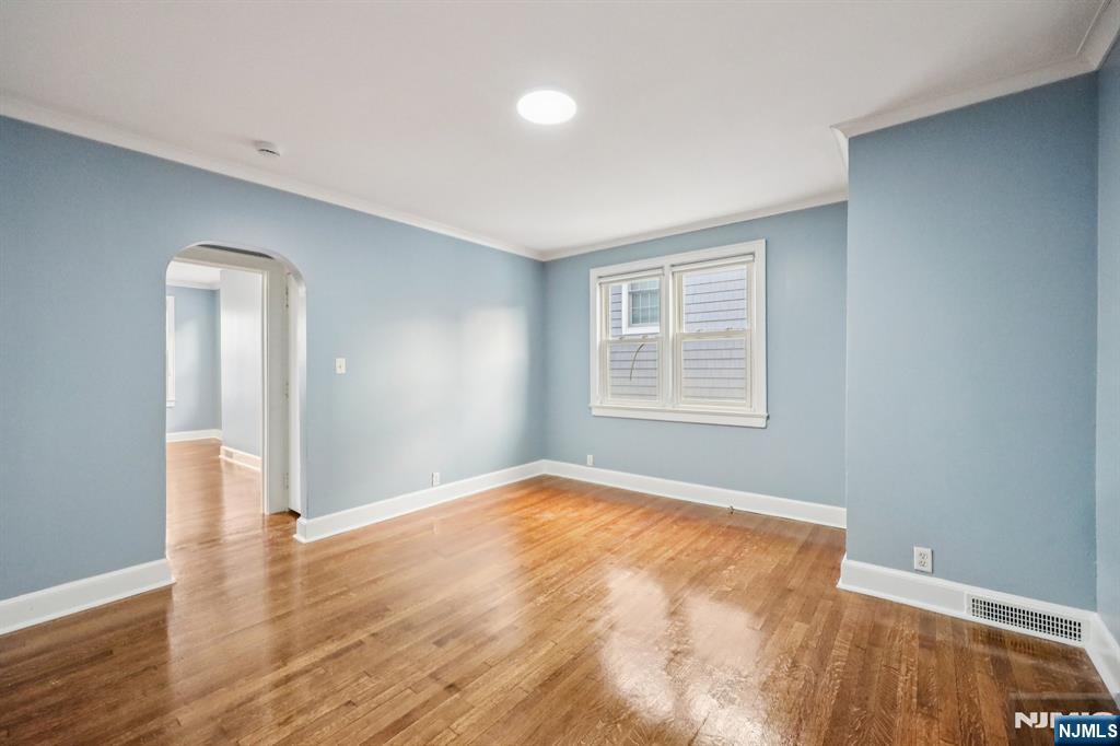 320 Orient Way, Unit 2 Rutherford, NJ 07070 - Photo 5 of 40 a view of empty room with wooden floor and fan