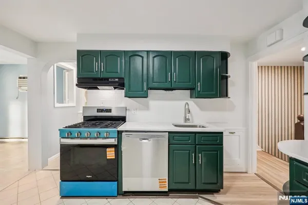 a kitchen with a stove and a cabinets