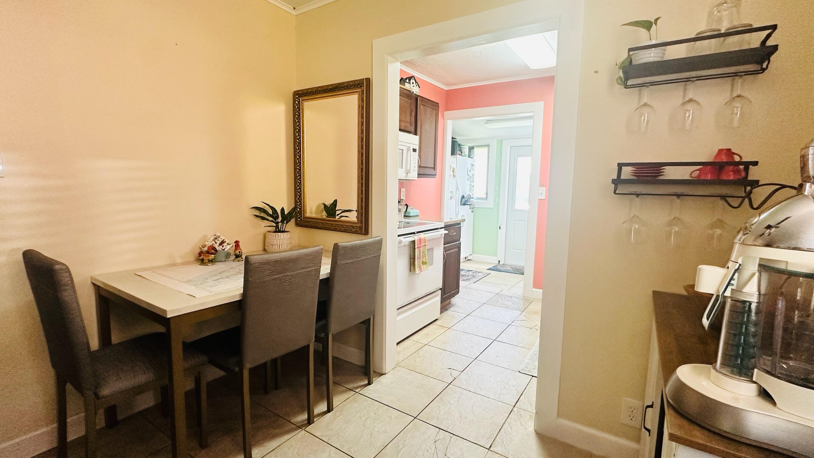 2500 Harris Avenue Key West, FL 33040 - Photo 14 of 22 a view of a dining room with furniture and a window
