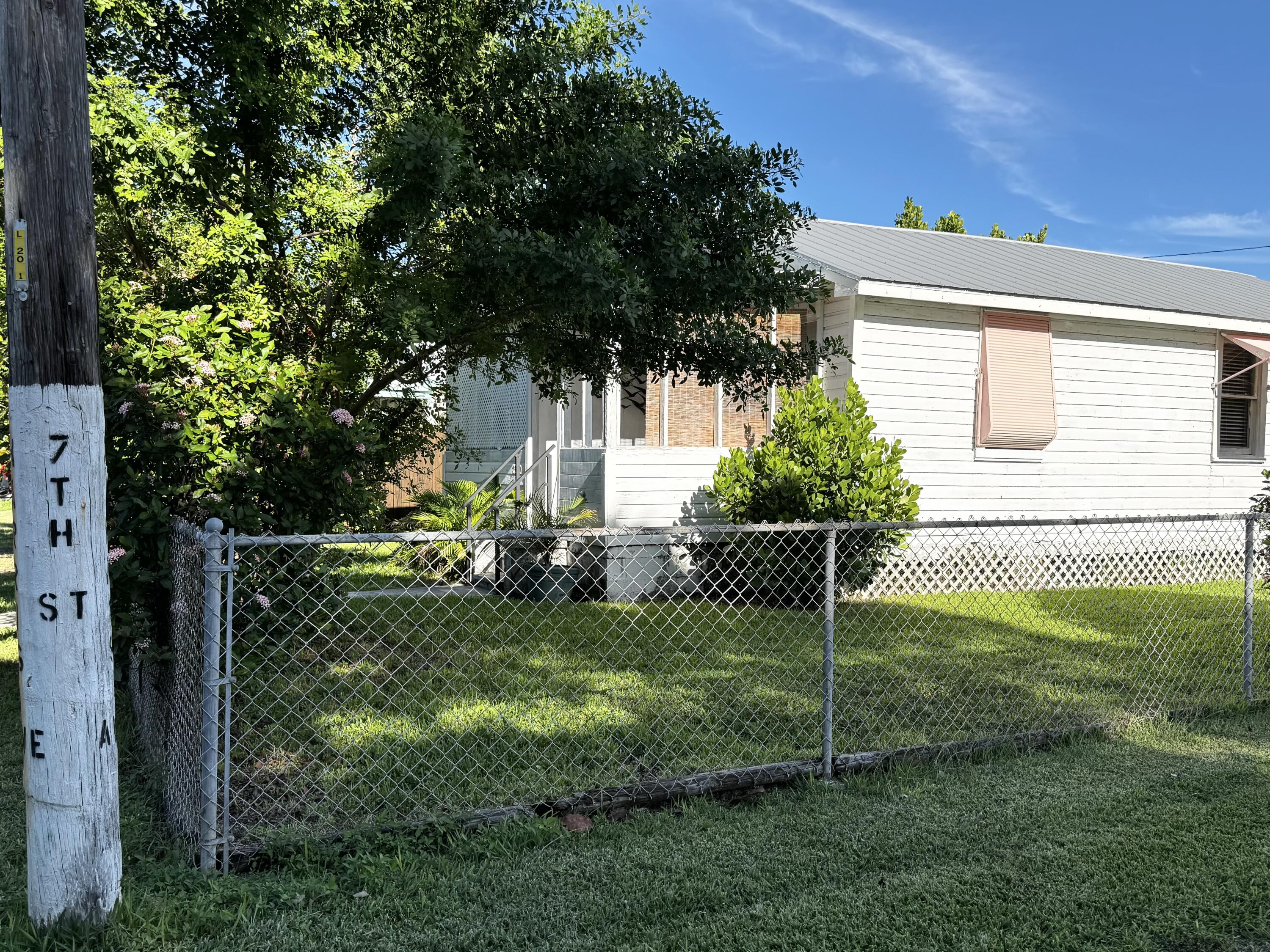 2500 Harris Avenue Key West, FL 33040 - Photo 17 of 22 a garden with trees in front of it