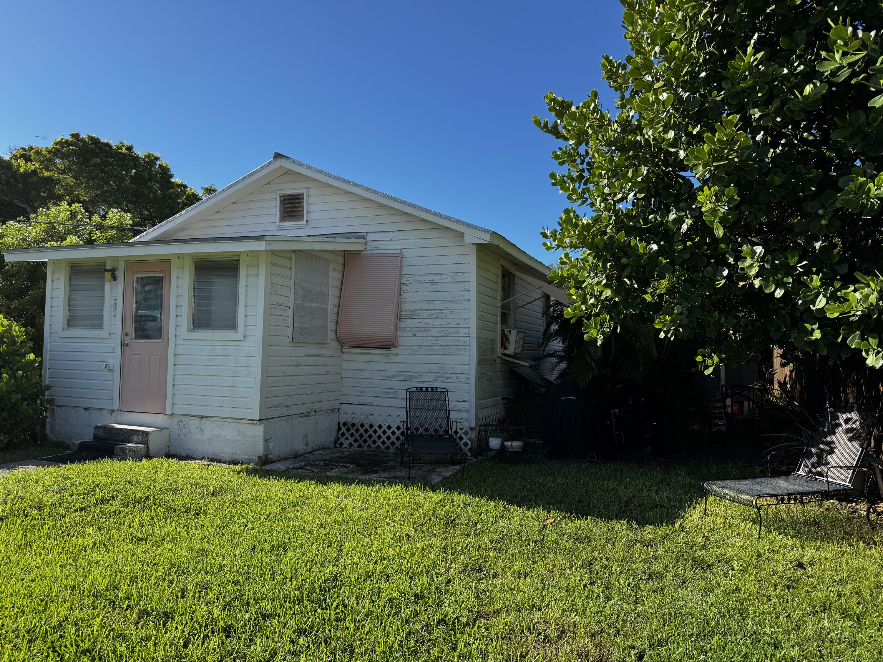 2500 Harris Avenue Key West, FL 33040 - Photo 21 of 22 a front view of a house with a yard