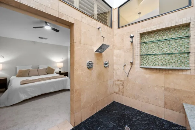 a bathroom with a bathtub and shower